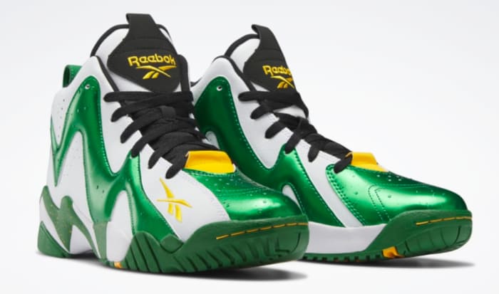 View of green and white Reebok shoes.